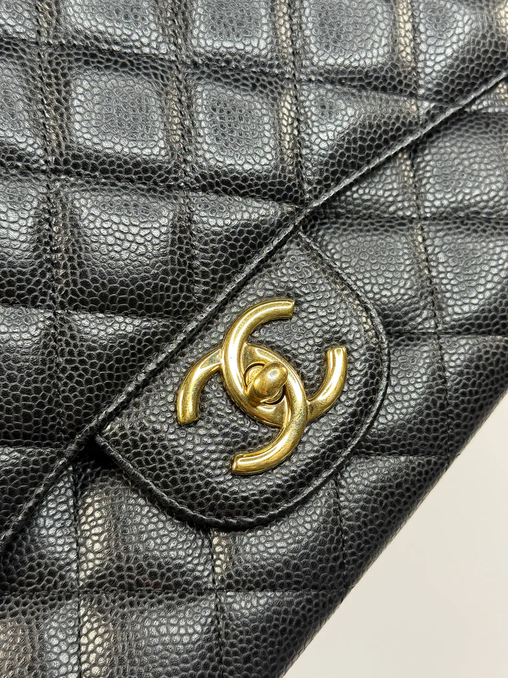 CHANEL MAXI CLASSIC DOUBLE FLAP IN BLACK CAVIAR LEATHER WITH GOLD HARDWARE