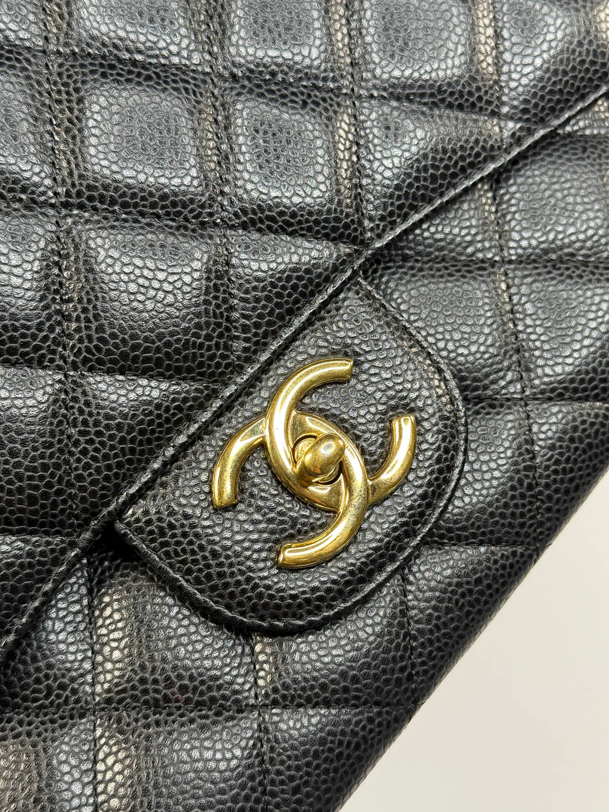 CHANEL MAXI CLASSIC DOUBLE FLAP IN BLACK CAVIAR LEATHER WITH GOLD HARDWARE