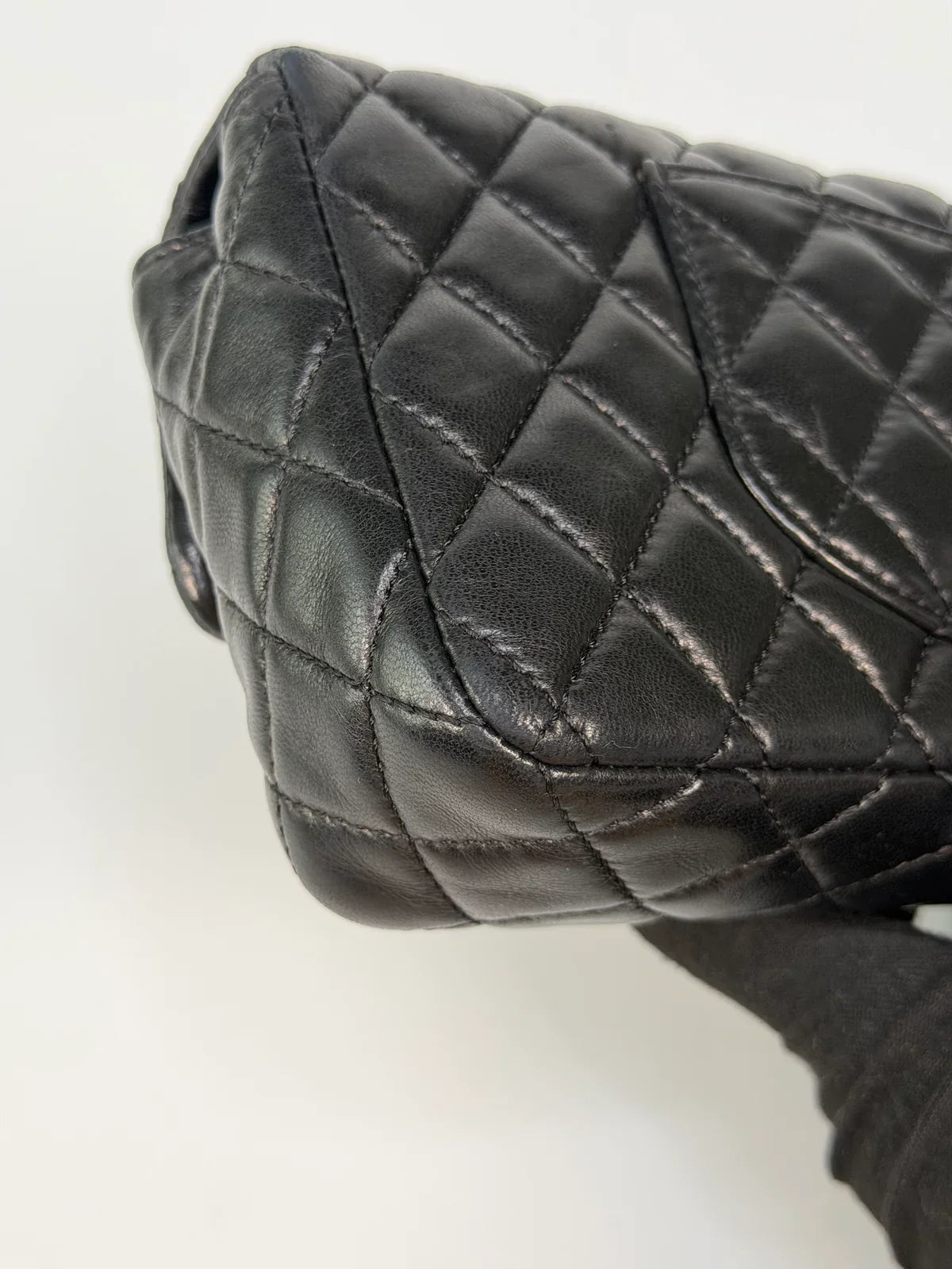 CHANEL EAST WEST CHARMS BAG IN BLACK LAMBSKIN LEATHER WITH GOLD HARDWARE