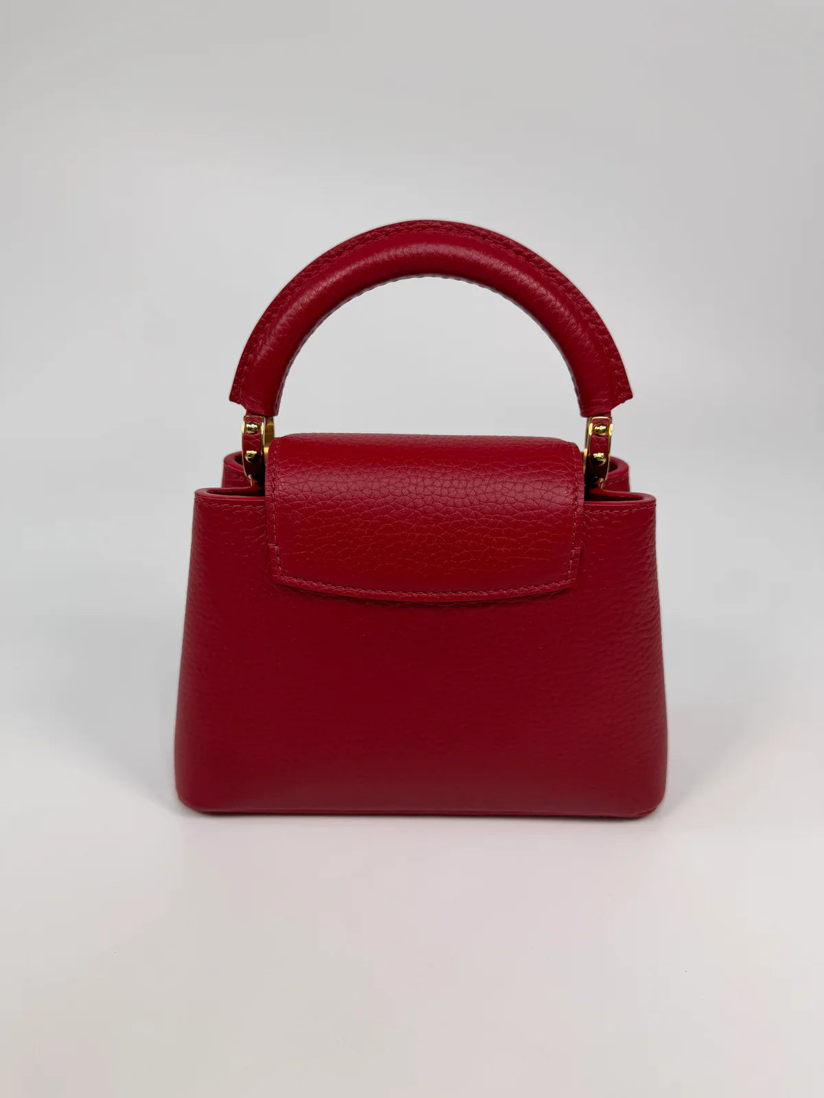 LOUIS VUITTON CAPUCINES MINI BAG IN SCARLET TAURILLION LEATHER WITH GOLD HARDWARE
