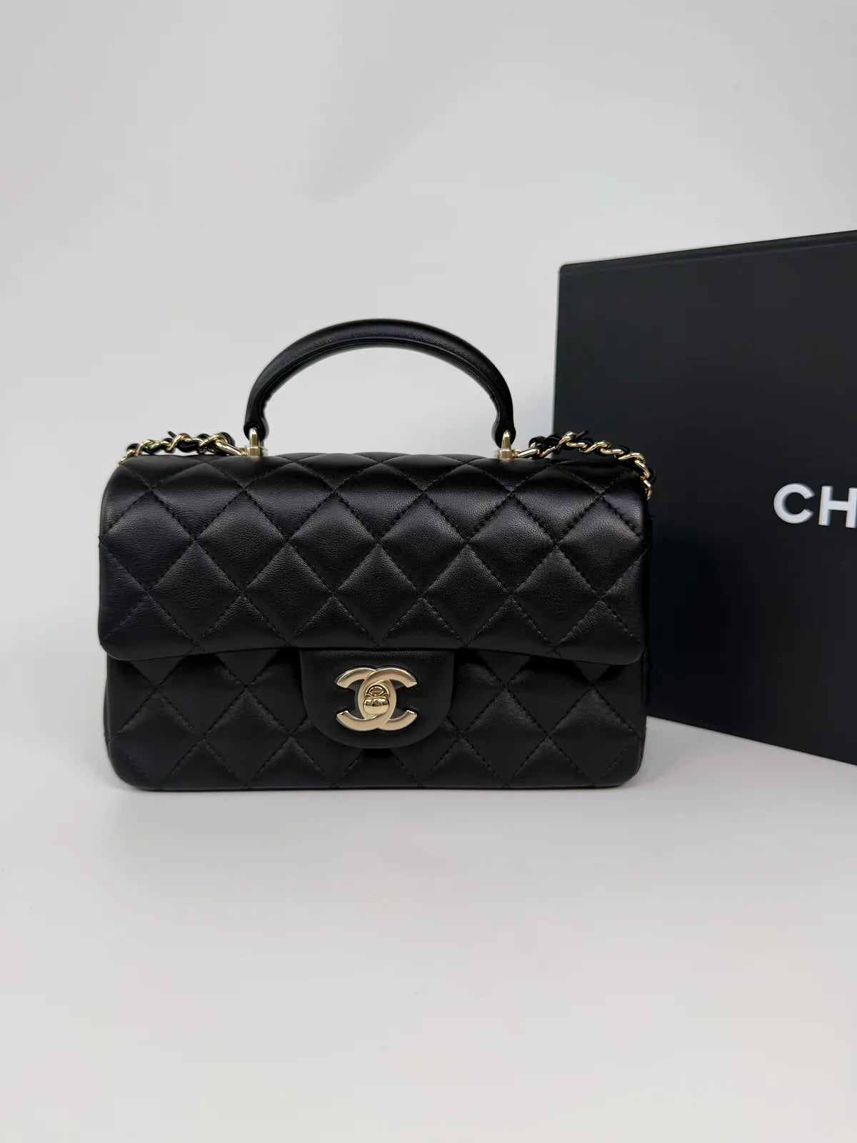 CHANEL MINI RECTANGLE TOP HANDLE IN BLACK LAMBSKIN LEATHER WITH PALE GOLD HARDWARE