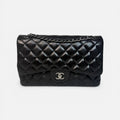 CHANEL JUMBO CLASSIC FLAP BAG IN BLACK LAMBSKIN LEATHER WITH SILVER HARDWARE