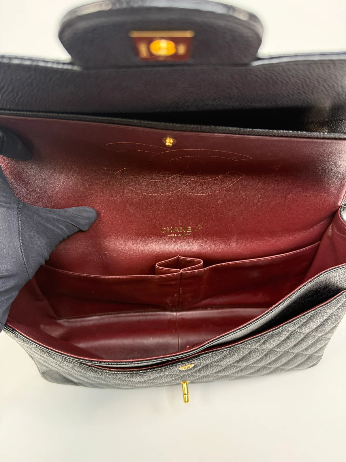 CHANEL MAXI CLASSIC DOUBLE FLAP IN BLACK CAVIAR LEATHER WITH GOLD HARDWARE