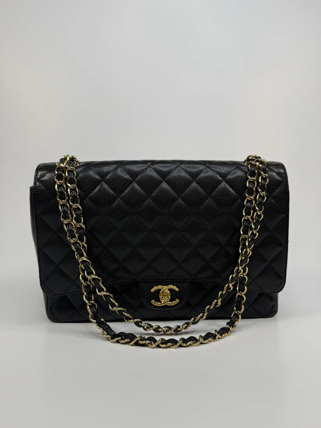 CHANEL MAXI CLASSIC DOUBLE FLAP IN BLACK CAVIAR LEATHER WITH GOLD HARDWARE