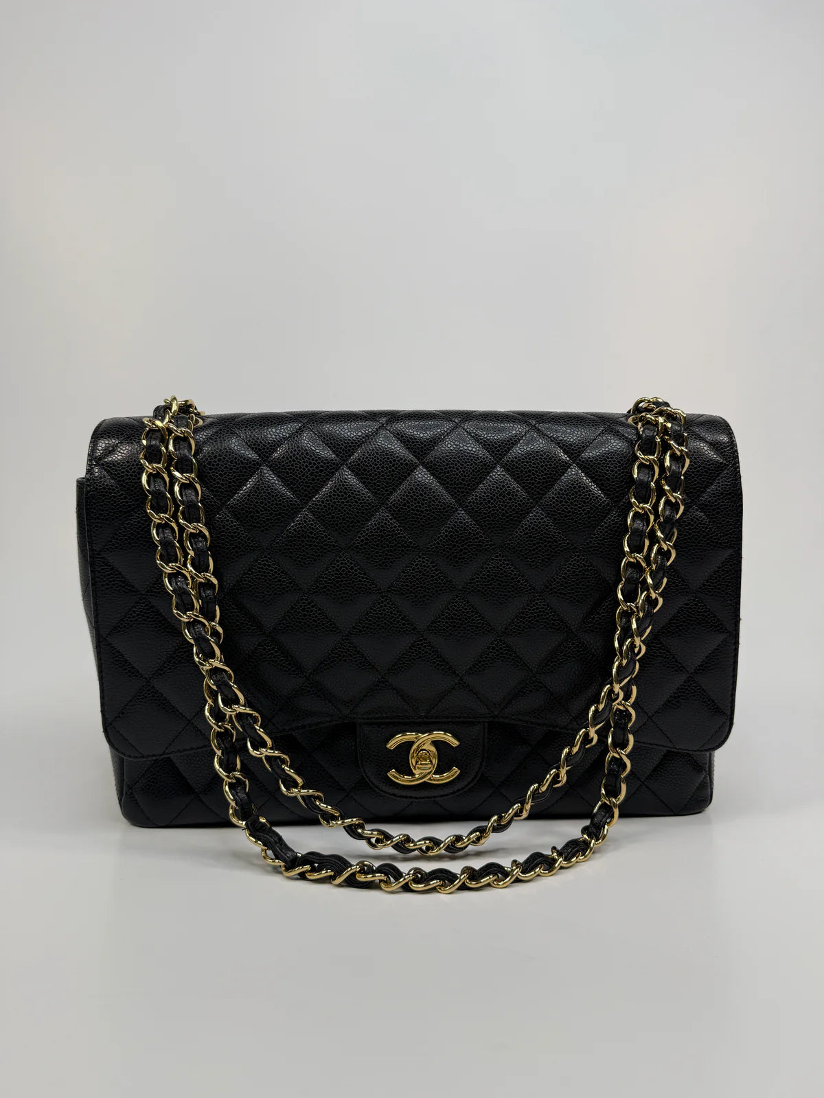 CHANEL MAXI CLASSIC DOUBLE FLAP IN BLACK CAVIAR LEATHER WITH GOLD HARDWARE