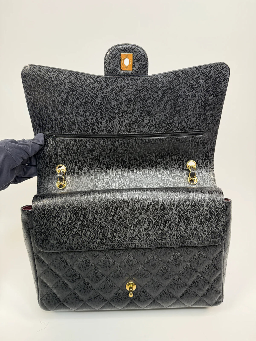 CHANEL MAXI CLASSIC DOUBLE FLAP IN BLACK CAVIAR LEATHER WITH GOLD HARDWARE