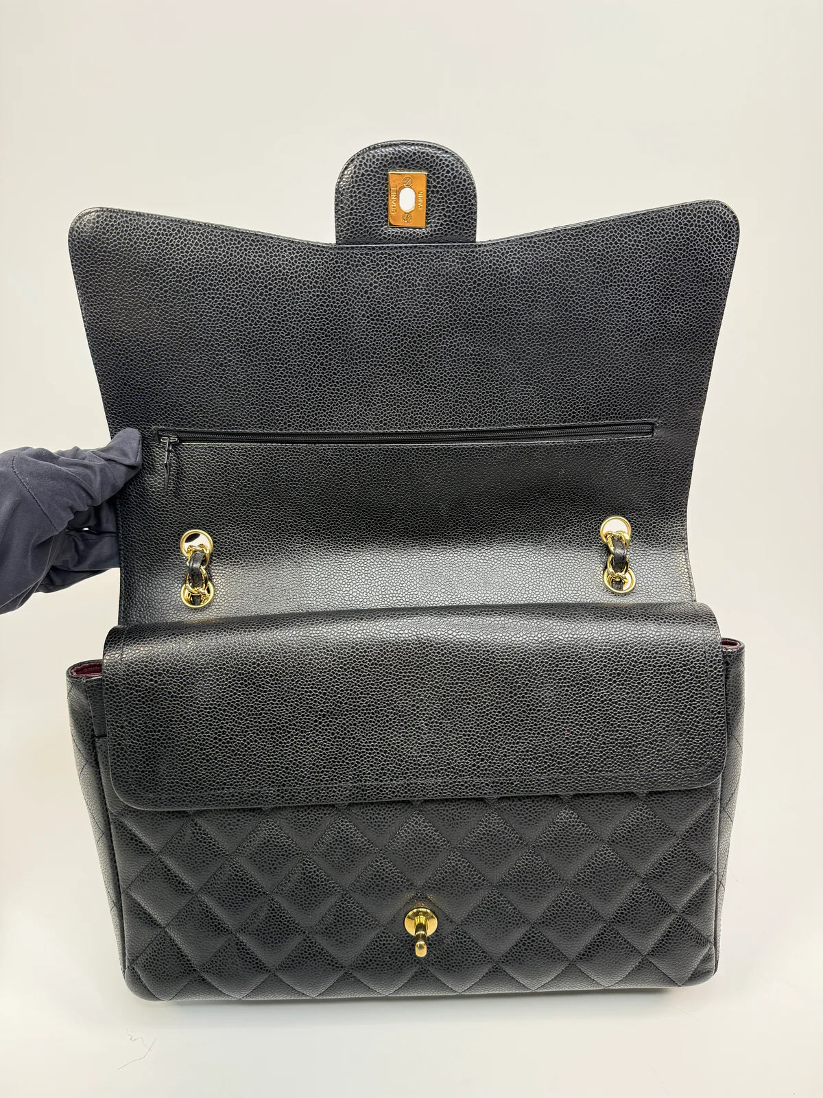 CHANEL MAXI CLASSIC DOUBLE FLAP IN BLACK CAVIAR LEATHER WITH GOLD HARDWARE