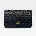 CHANEL BLACK LAMBSKIN LEATHER JUMBO CLASSIC DOUBLE FLAP GOLD HARDWARE