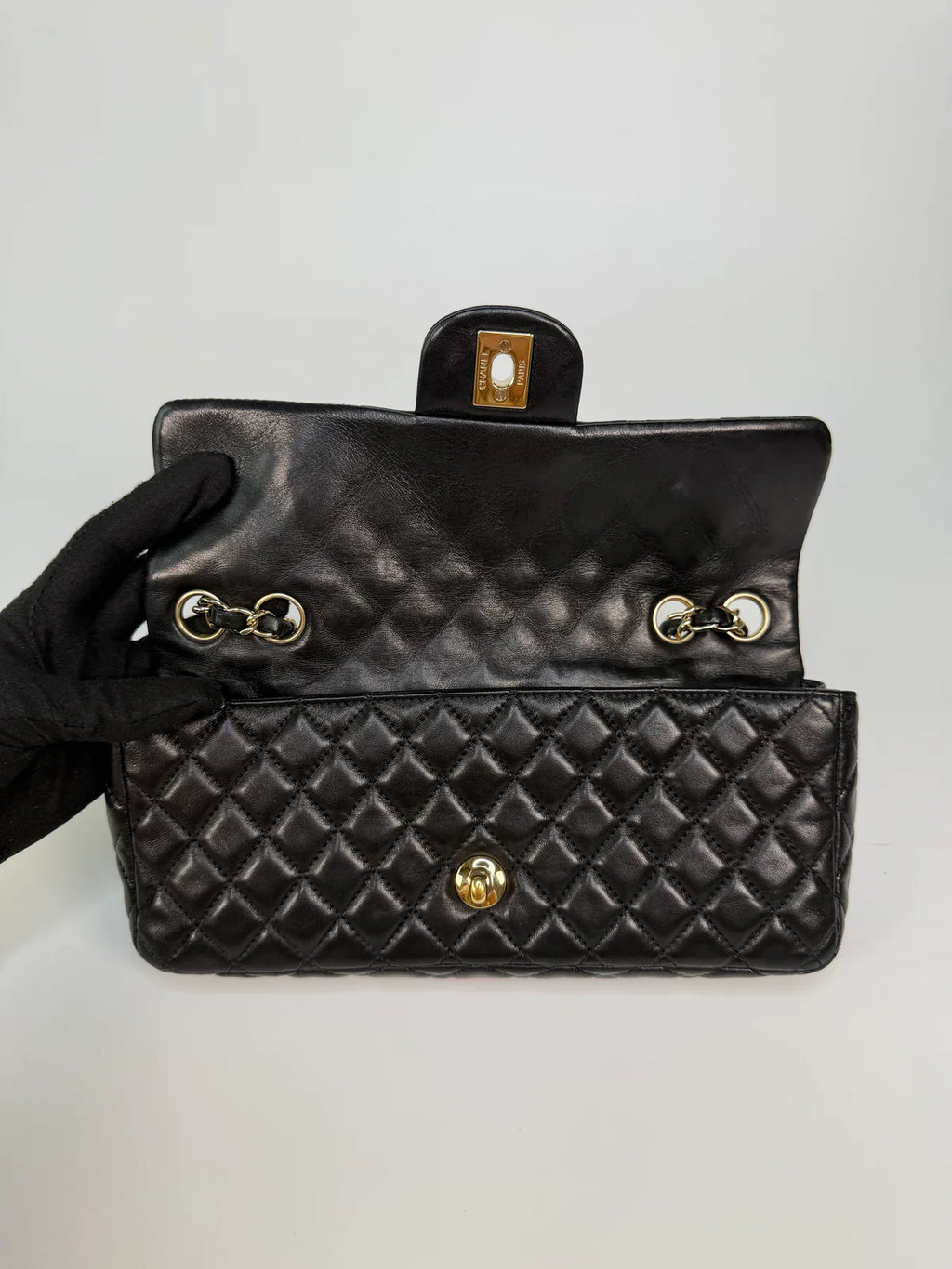 CHANEL EAST WEST CHARMS BAG IN BLACK LAMBSKIN LEATHER WITH GOLD HARDWARE