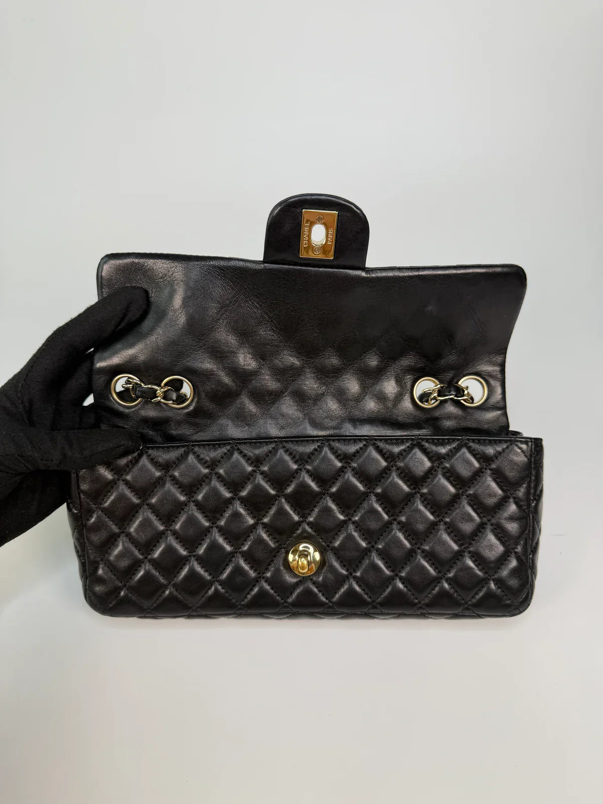 CHANEL EAST WEST CHARMS BAG IN BLACK LAMBSKIN LEATHER WITH GOLD HARDWARE