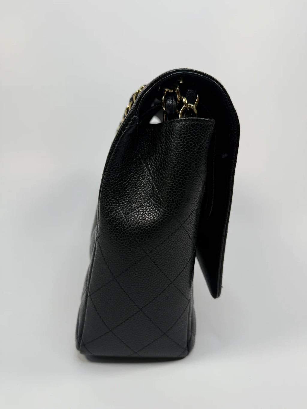 CHANEL MAXI CLASSIC DOUBLE FLAP IN BLACK CAVIAR LEATHER WITH GOLD HARDWARE