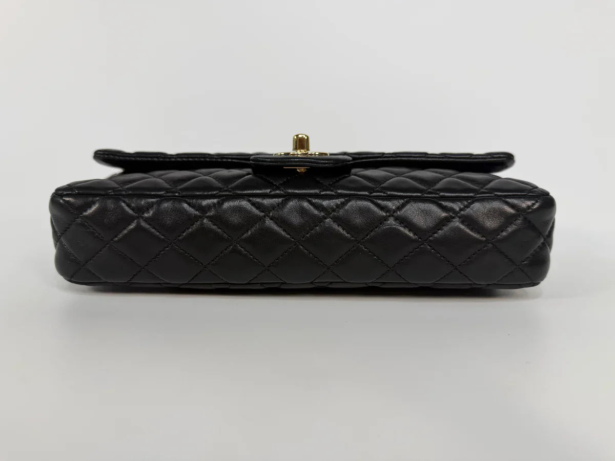 CHANEL EAST WEST CHARMS BAG IN BLACK LAMBSKIN LEATHER WITH GOLD HARDWARE