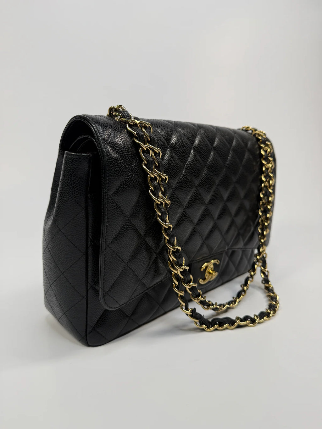 CHANEL MAXI CLASSIC DOUBLE FLAP IN BLACK CAVIAR LEATHER WITH GOLD HARDWARE