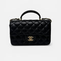 CHANEL MINI RECTANGLE TOP HANDLE FLAP BAG IN BLACK LAMBSKIN WITH PALE GOLD HARDWARE