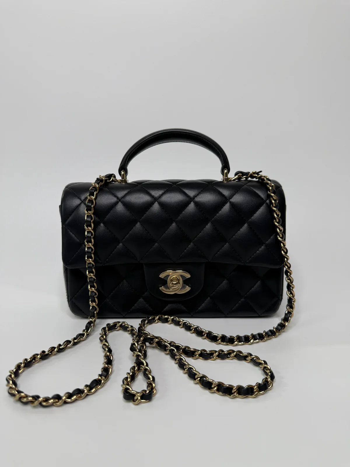 CHANEL MINI RECTANGLE TOP HANDLE FLAP BAG IN BLACK LAMBSKIN WITH PALE GOLD HARDWARE