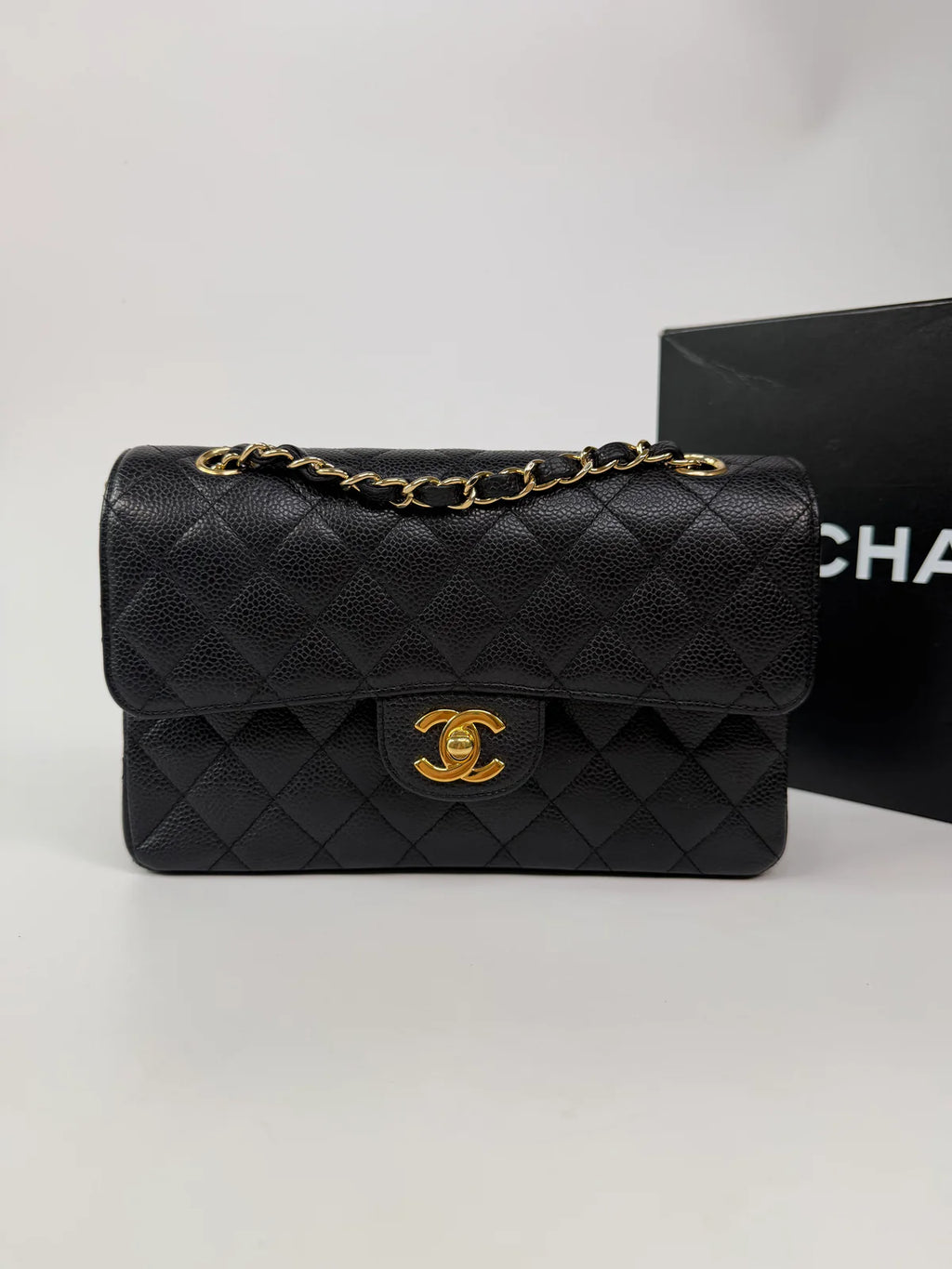 CHANEL SMALL CLASSIC DOUBLE FLAP IN BLACK CAVIAR LEATHER WITH GOLD HARDWARE