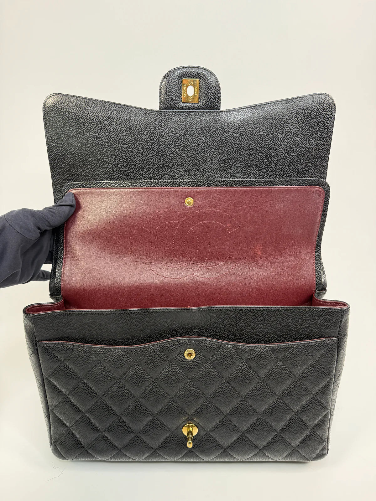 CHANEL MAXI CLASSIC DOUBLE FLAP IN BLACK CAVIAR LEATHER WITH GOLD HARDWARE